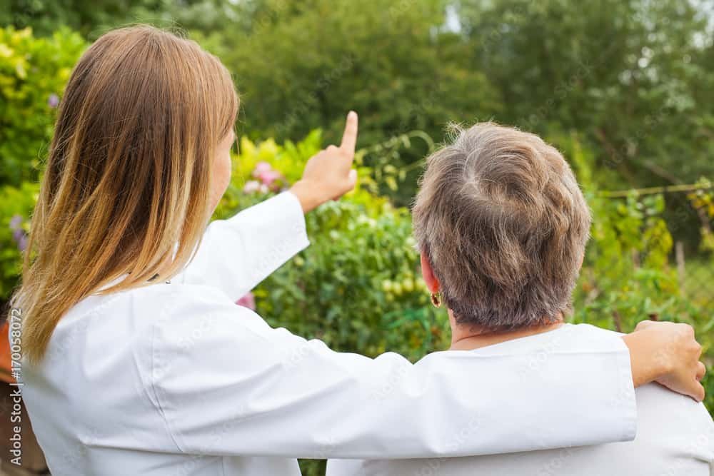 Elderly woman with female doctor